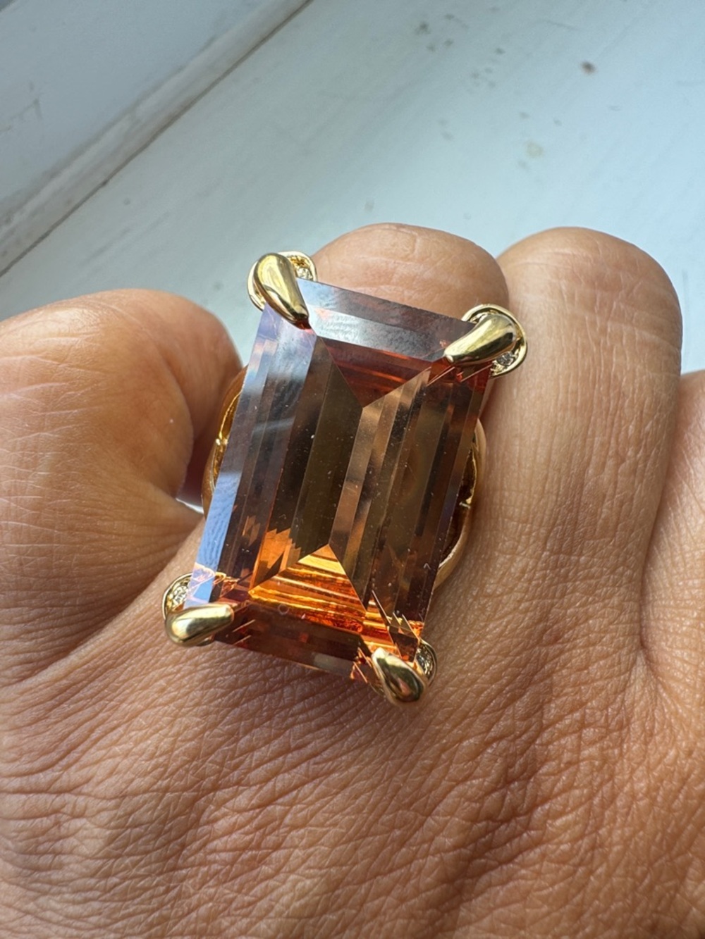Elegant Gold Ring with Large Amber-Brown Rectangular Gem